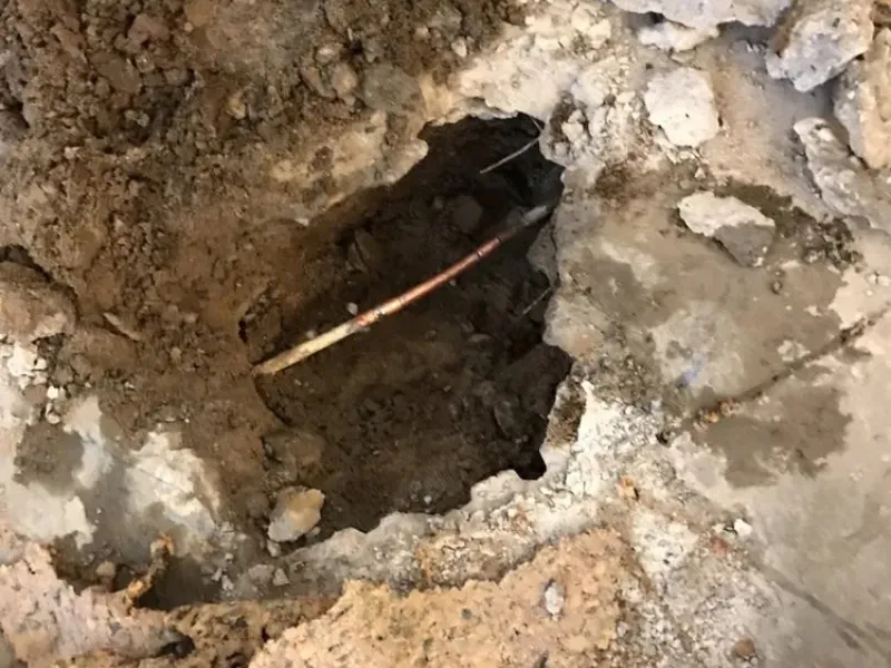 Targeted repair of a pipe beneath a concrete slab