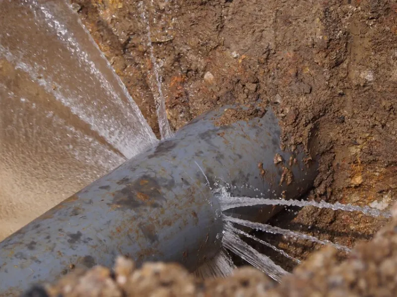 Water leak detection equipment inspecting a wall